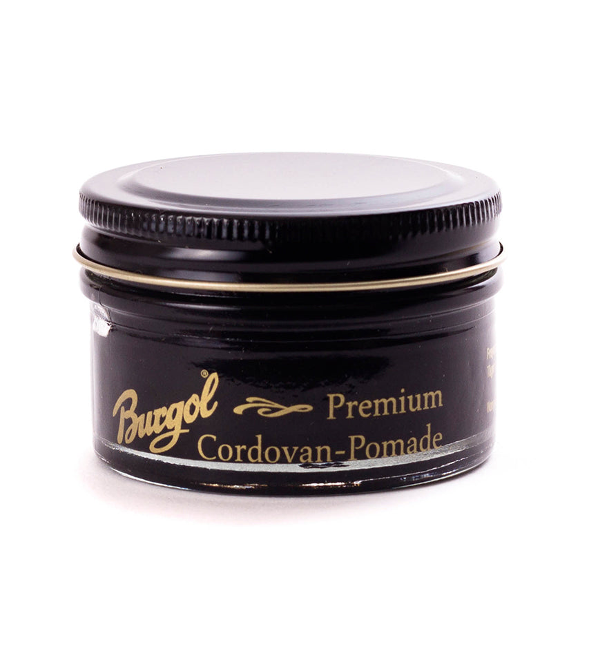Burgol Cordovan Pomade jar in black, closed lid, front label visible, angled three-quarter view on white background