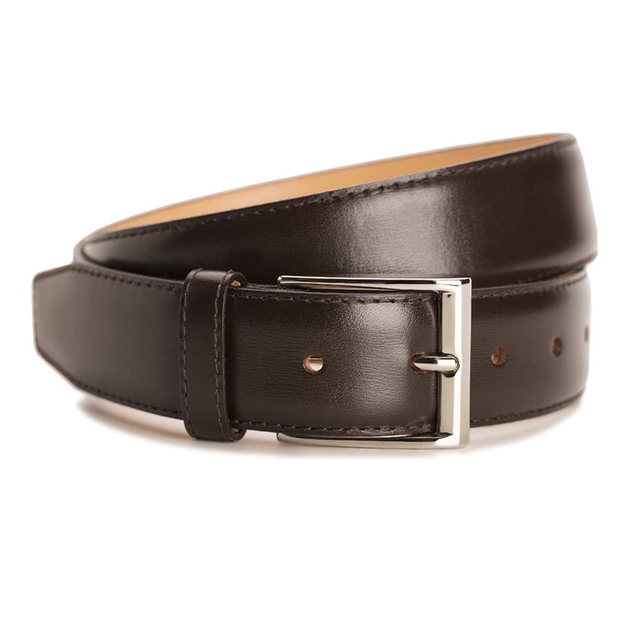 Meermin dark brown calf belt, coiled front view showing nickel-plated solid brass buckle and stitched keeper loop