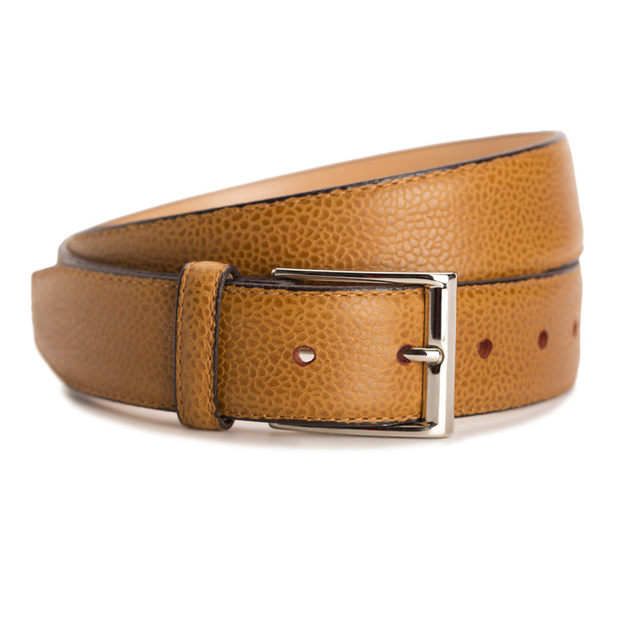 Meermin tan country calf belt coiled, buckle facing forward, showing pebbled grain texture and nickel-plated solid brass buckle