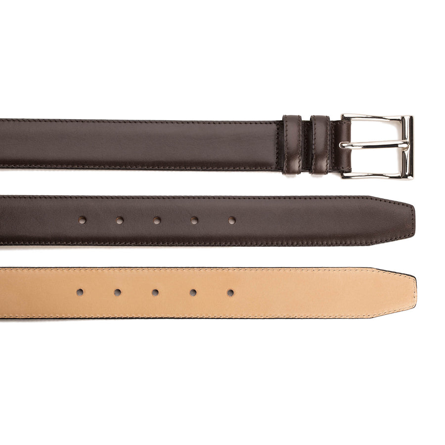 Meermin dark brown Naturcalf belt, three straps shown stacked: buckle end, hole punches, and natural leather underside