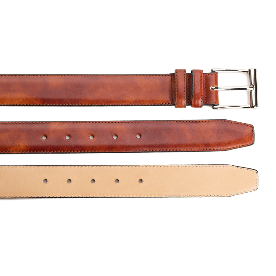 Meermin gold museum calf belt, three views showing buckle end, hole punches, and natural leather backing