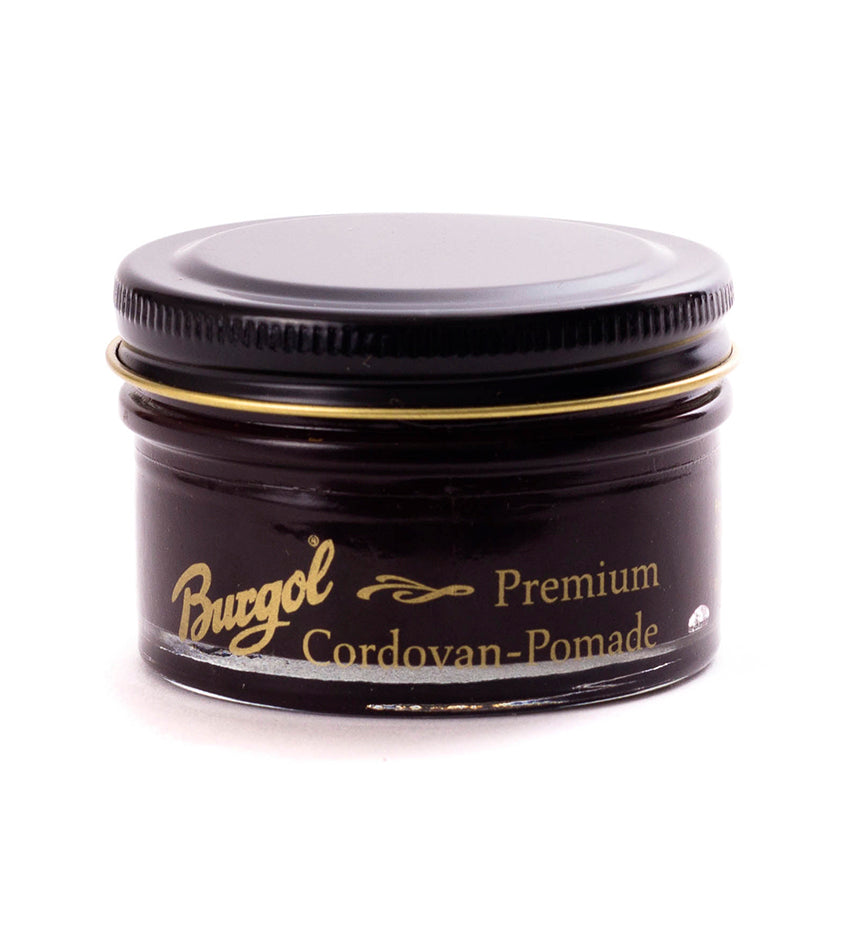 Burgol Cordovan Pomade jar with screw-on lid, angled front view showing gold label text on dark glass