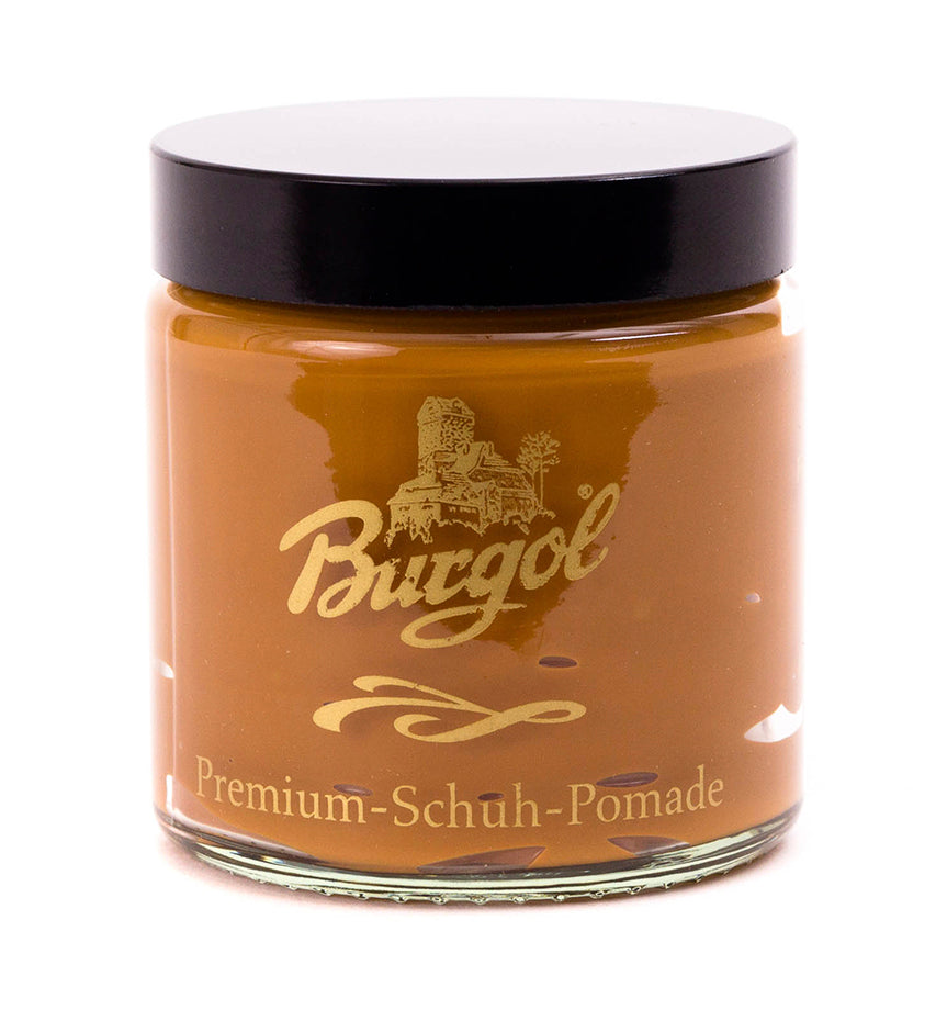 Burgol Premium-Schuh-Pomade in light brown, glass jar with black lid, front label facing camera on white background