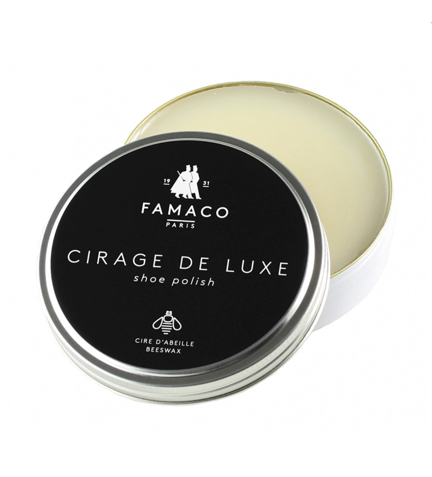 Famaco Cirage de Luxe tin, lid propped open showing pale beeswax polish inside, neutral shade