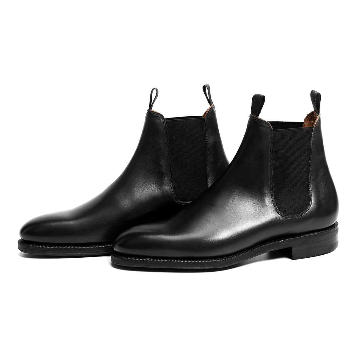 Meermin black boxcalf wholecut Chelsea boots, three-quarter front view of both pairs showing tapered leg and pull tabs