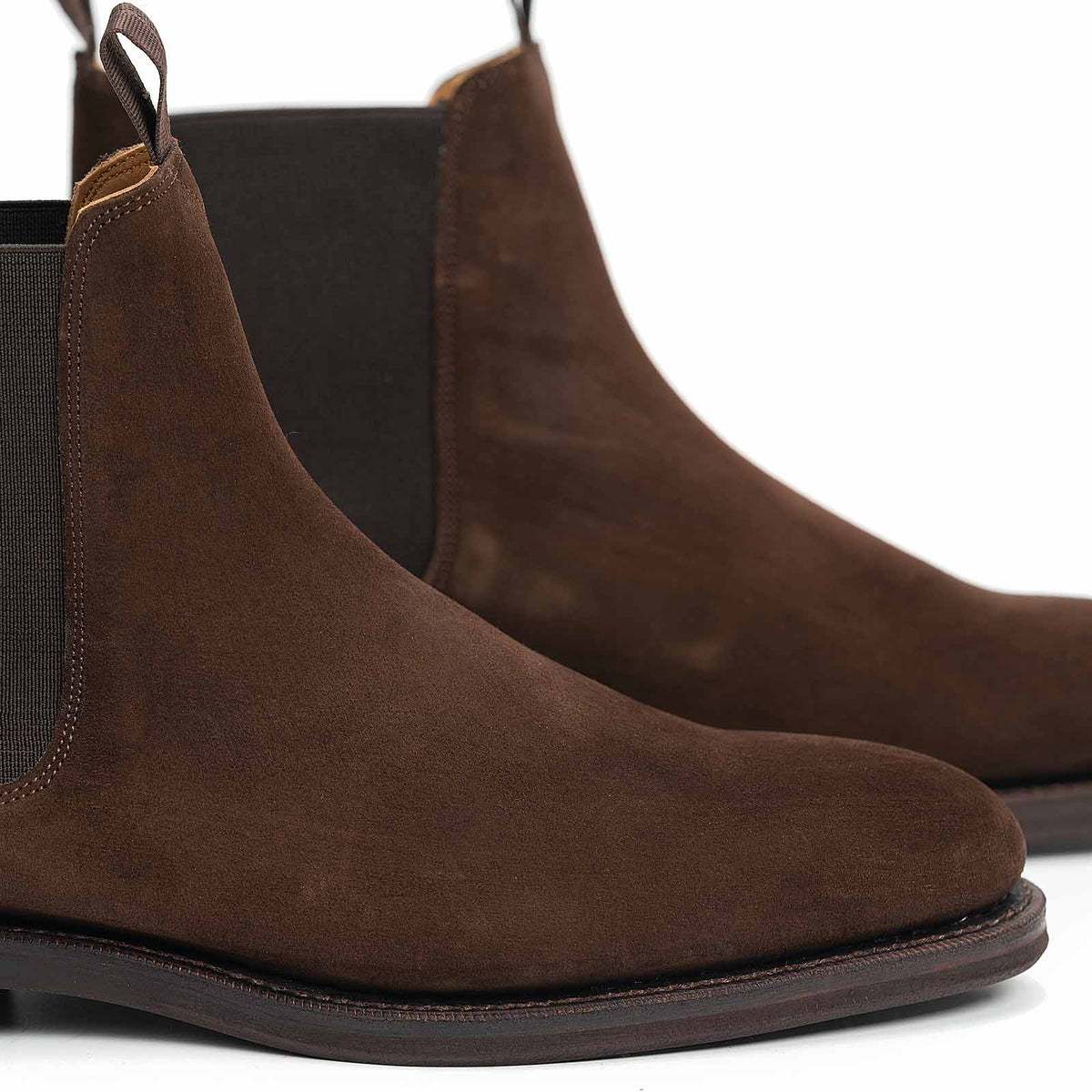 Meermin brown suede Chelsea boots, close-up side view showing elastic gores, rounded toe, and stacked sole detail