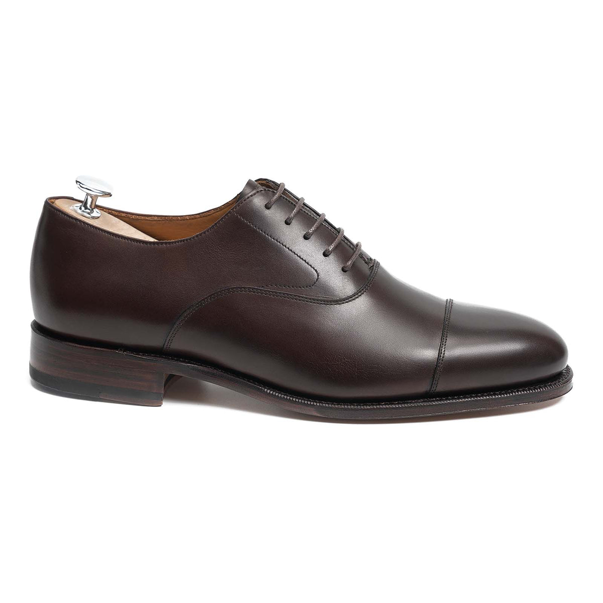 Meermin dark brown calfskin cap-toe Oxford, side profile with shoe tree inserted, showing Goodyear welted leather sole