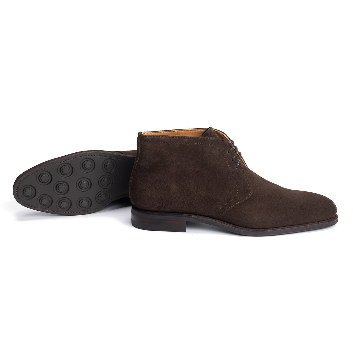 Meermin brown suede chukka boot, side profile with paired boot laid on its side showing studded rubber sole tread