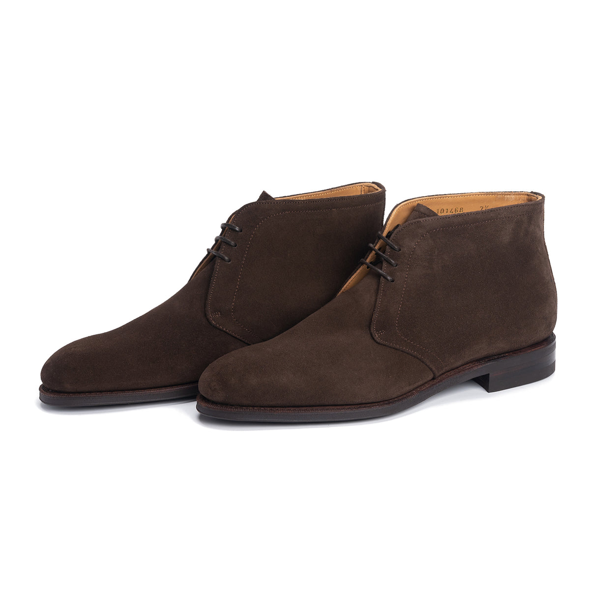 Meermin brown suede chukka boots, three-quarter front view showing lacing detail and Goodyear welted sole construction