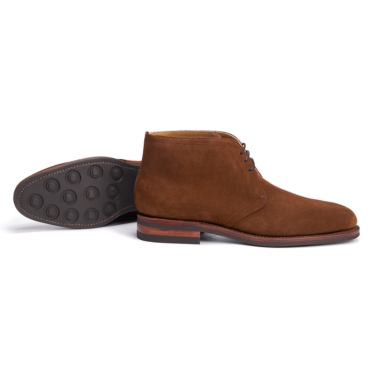 Meermin snuff suede chukka boot, side profile with matching sole turned up, showing studded rubber sole and stacked leather heel