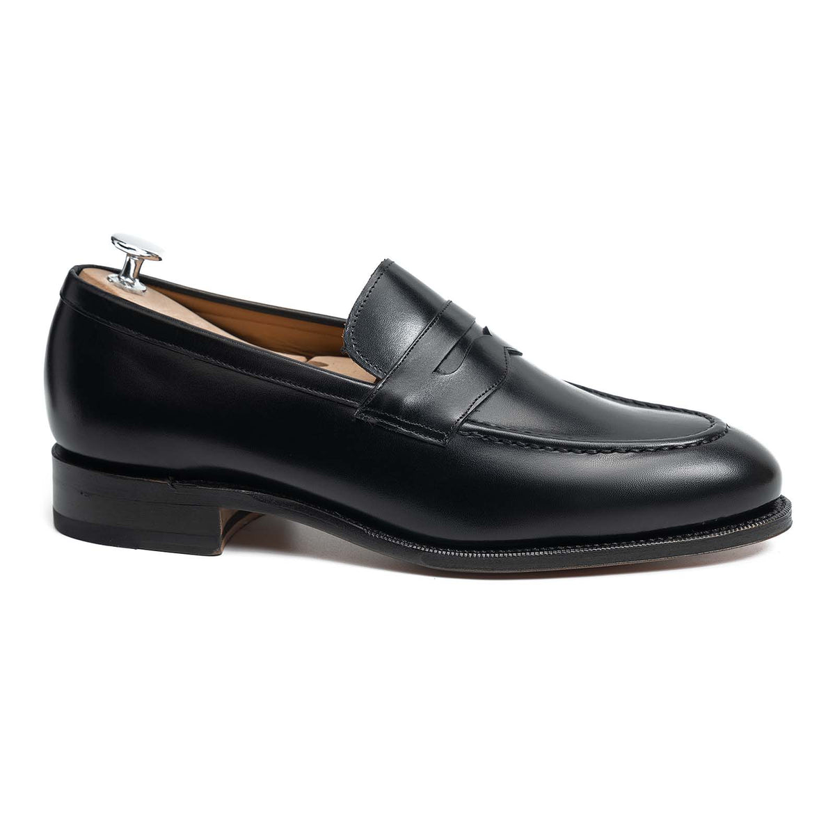 Meermin black calfskin penny loafer, side profile with shoe tree, showing Goodyear welt and closed channel leather sole