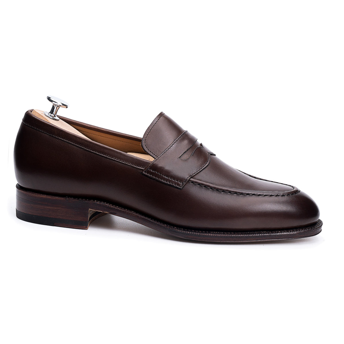 Meermin espresso antique calf penny loafer, side profile on shoe tree, showing apron stitching and stacked leather heel