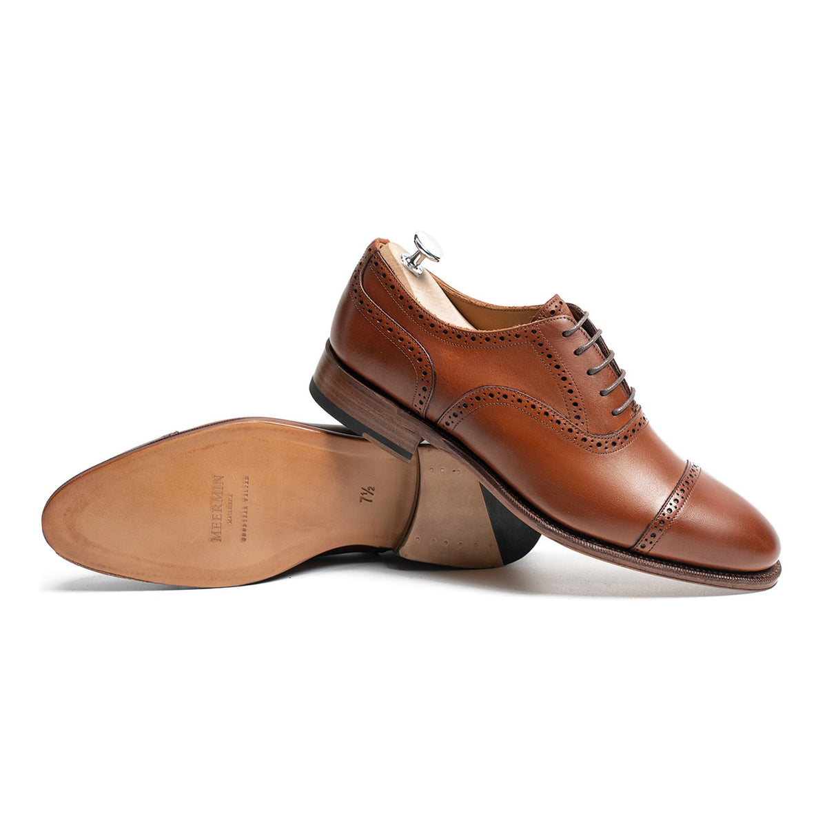 Meermin tan antique calf cap-toe Oxford, paired shoes with one on shoe tree, sole and heel visible on the resting pair