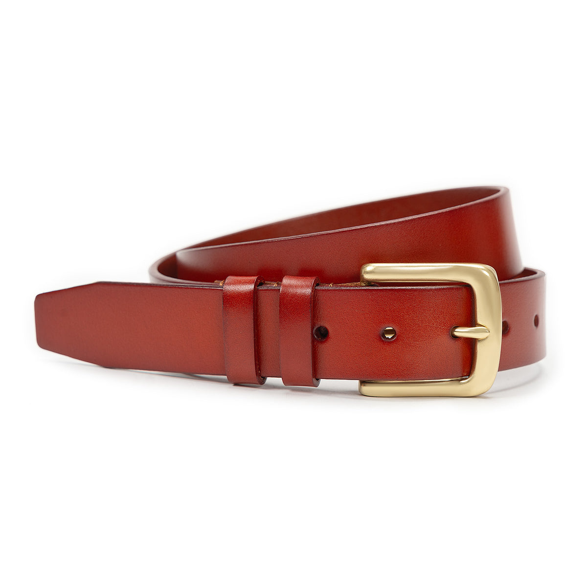 Meermin tan bridle leather belt coiled loosely, showing solid brass buckle and keeper loops in close-up side view