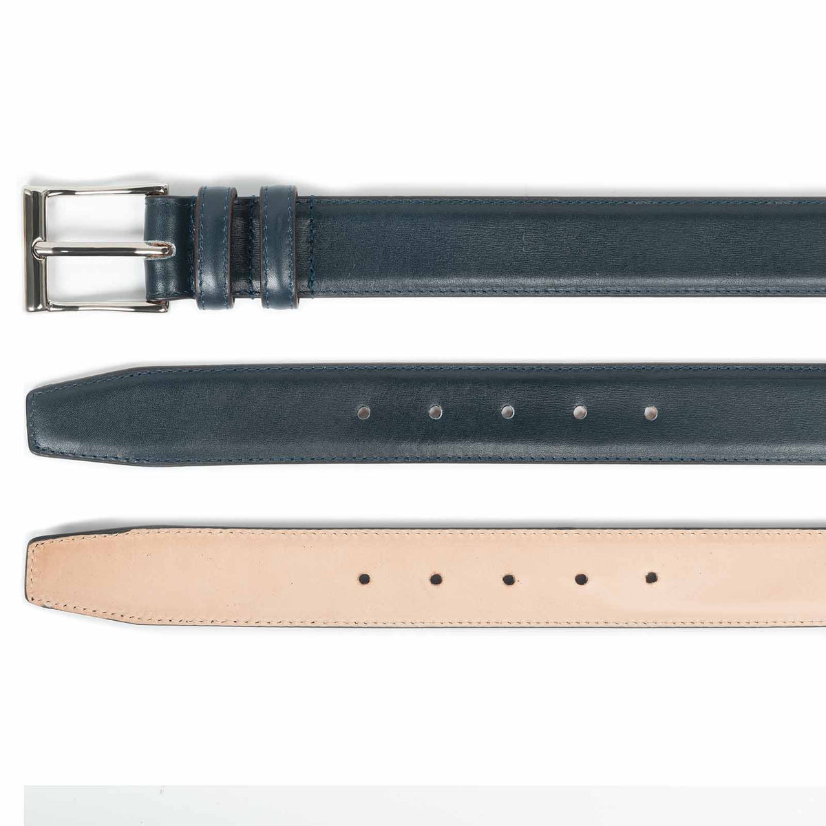 Meermin navy Naturcalf belt, three-part view showing buckle end, punched holes, and natural leather underside lining