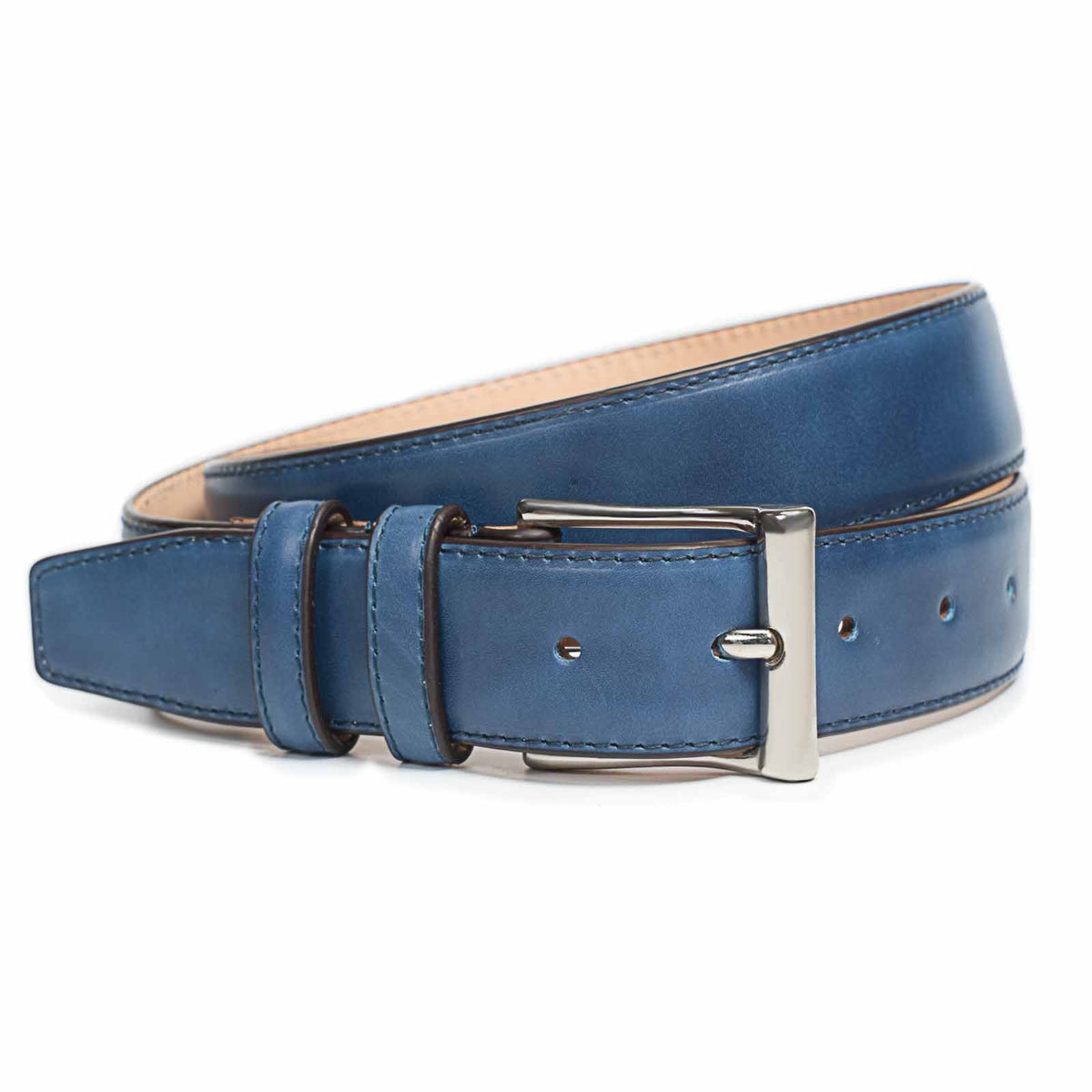 Meermin navy museum calf belt, coiled to show buckle and keeper loops, nickel-finish buckle in focus