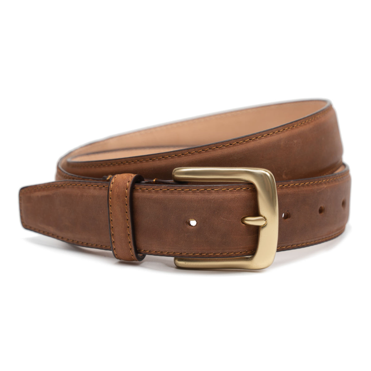 Meermin tobacco waxy shell cordovan belt, coiled to show solid brass buckle and stitched keeper detail
