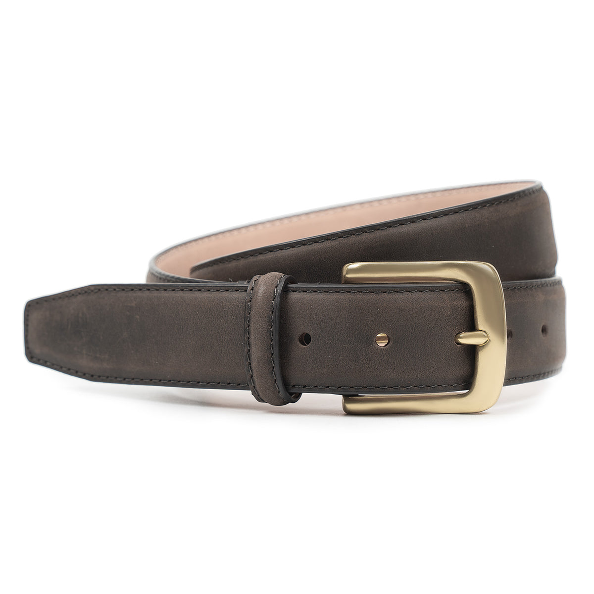 Meermin brown waxy calf belt, coiled to show solid brass buckle and stitched keeper, with pink-toned leather lining visible beneath