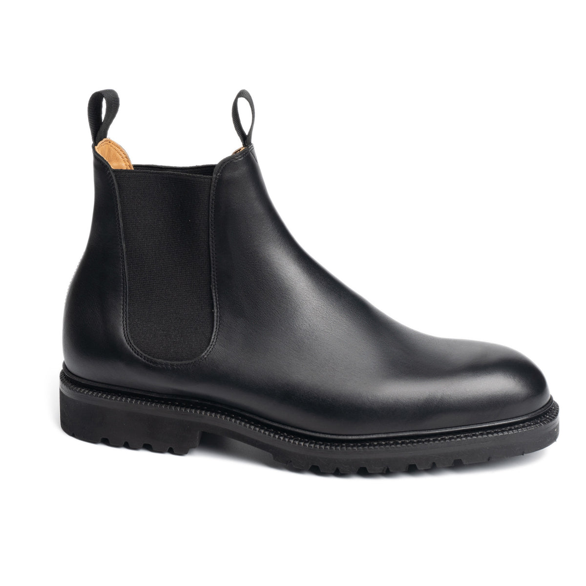 Meermin black boxcalf Chelsea boot, side profile view showing elastic gusset, pull tabs, and lightweight cleated sole