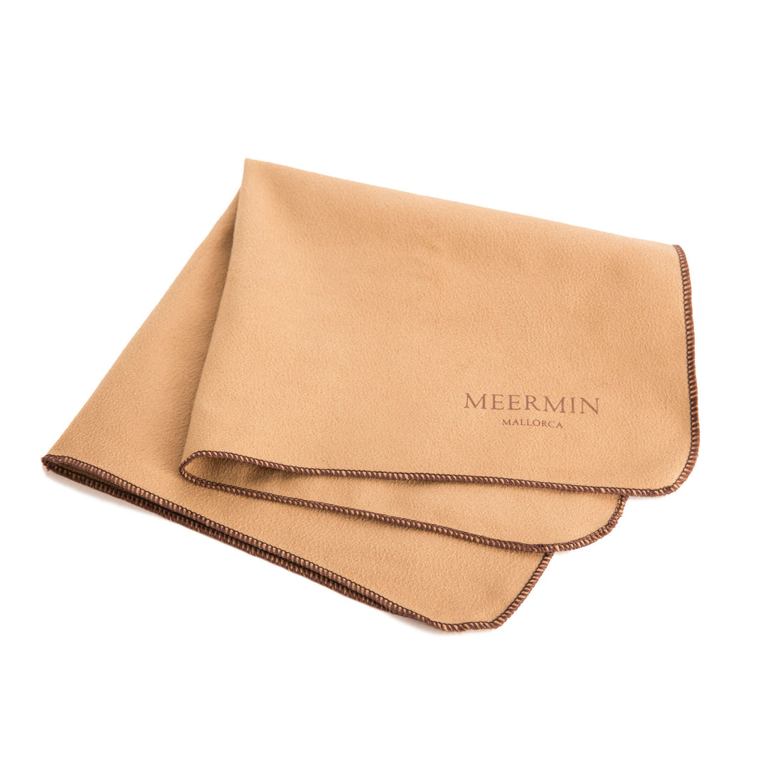 Meermin microfiber polishing cloth, folded, with tan surface and contrast stitched edges, logo visible on corner