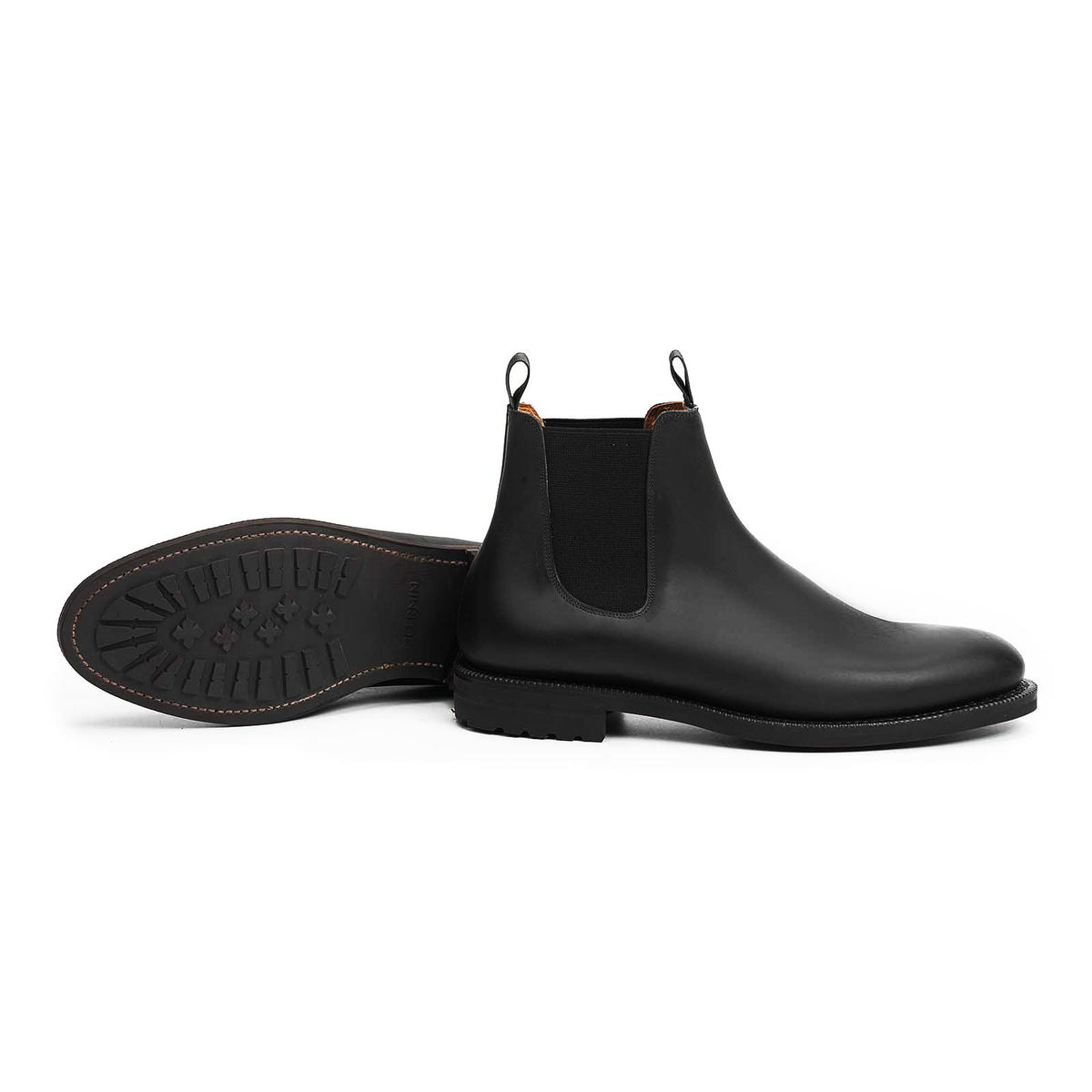 Meermin black waxy calf wholecut Chelsea boot, side profile paired with sole view showing double lug outsole tread