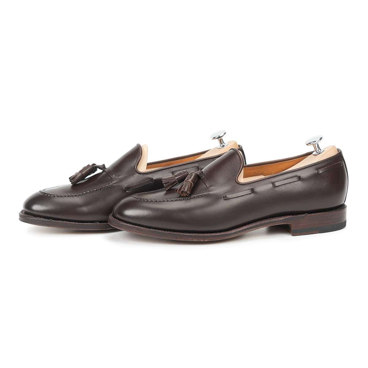 Meermin dark brown boxcalf tassel loafers, side profile pair on shoe trees, showing hand-sewn apron and Goodyear welted sole