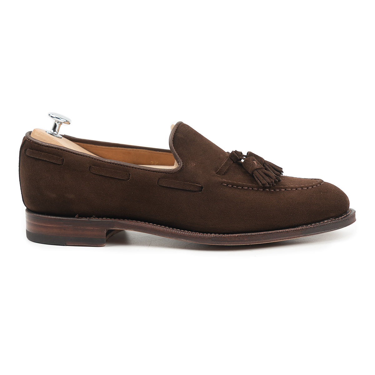 Meermin brown suede tassel loafer, side profile on shoe tree, showing Goodyear welted sole and hand-closed tassels