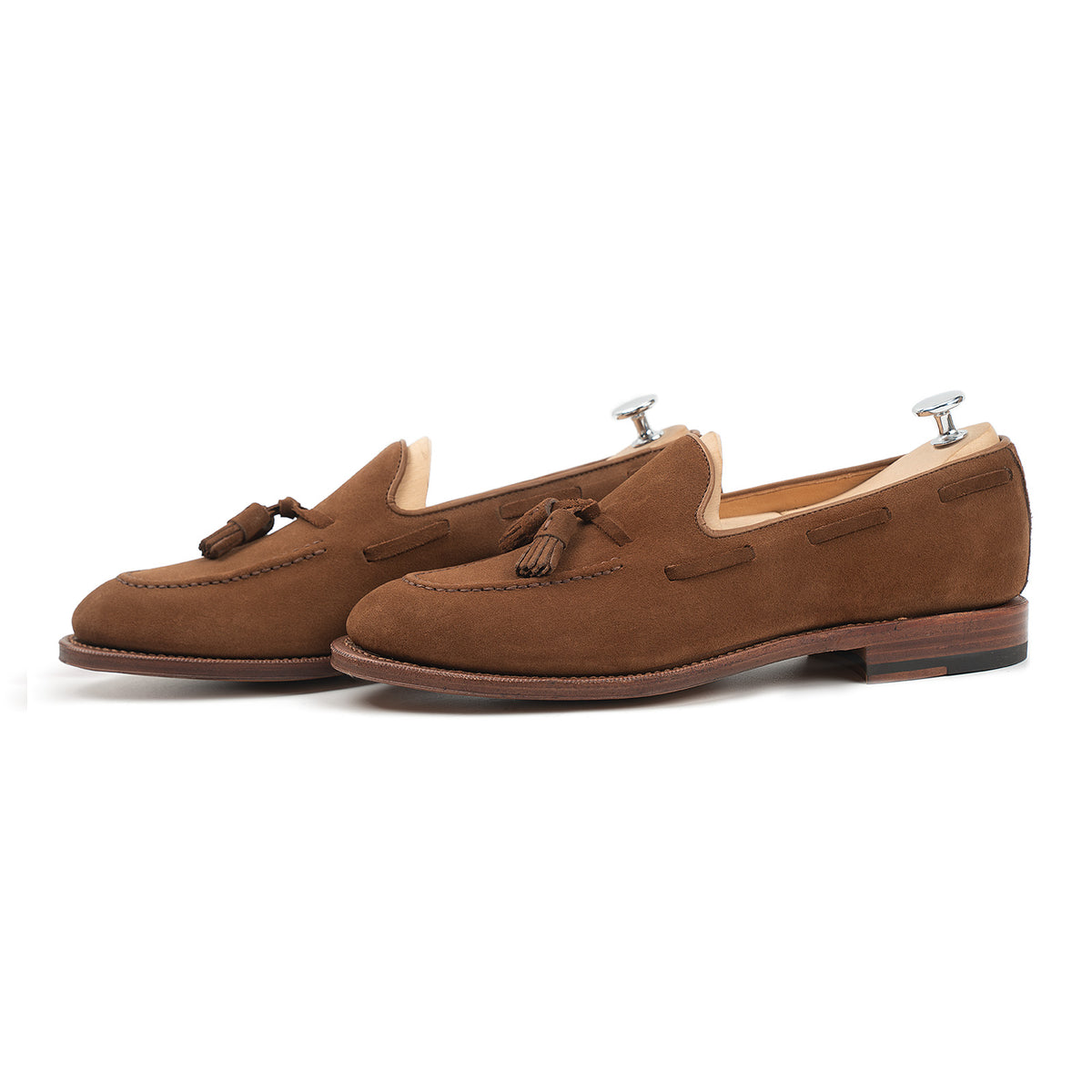 Meermin snuff suede tassel loafers, side-by-side profile view on shoe trees, showing hand-sewn apron and Goodyear welted sole