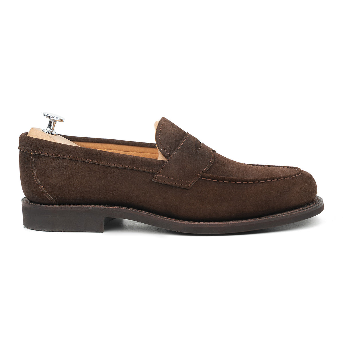 Meermin brown suede penny loafer, side profile on shoe tree showing apron stitching, City rubber sole and stacked heel