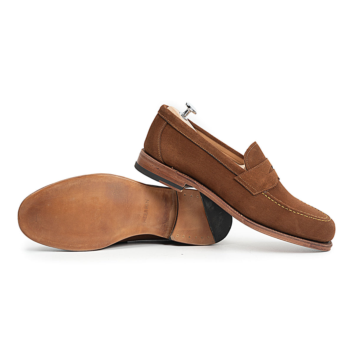 Meermin snuff suede penny loafers, one shoe on its side showing the sole and heel, the other upright with a shoe tree