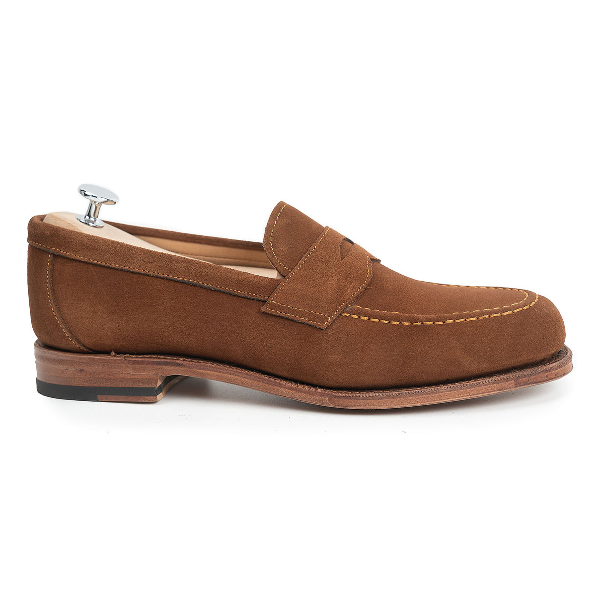 Meermin snuff superbuck suede penny loafer, side profile on a shoe tree, showing apron stitching and leather sole