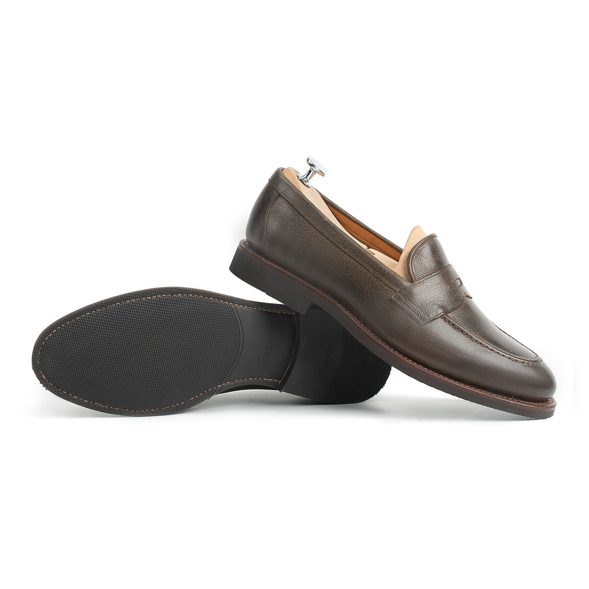 Meermin Caper Green naked kudu penny loafer, side profile with paired sole shown, on shoe tree, diamond latex rubber sole visible
