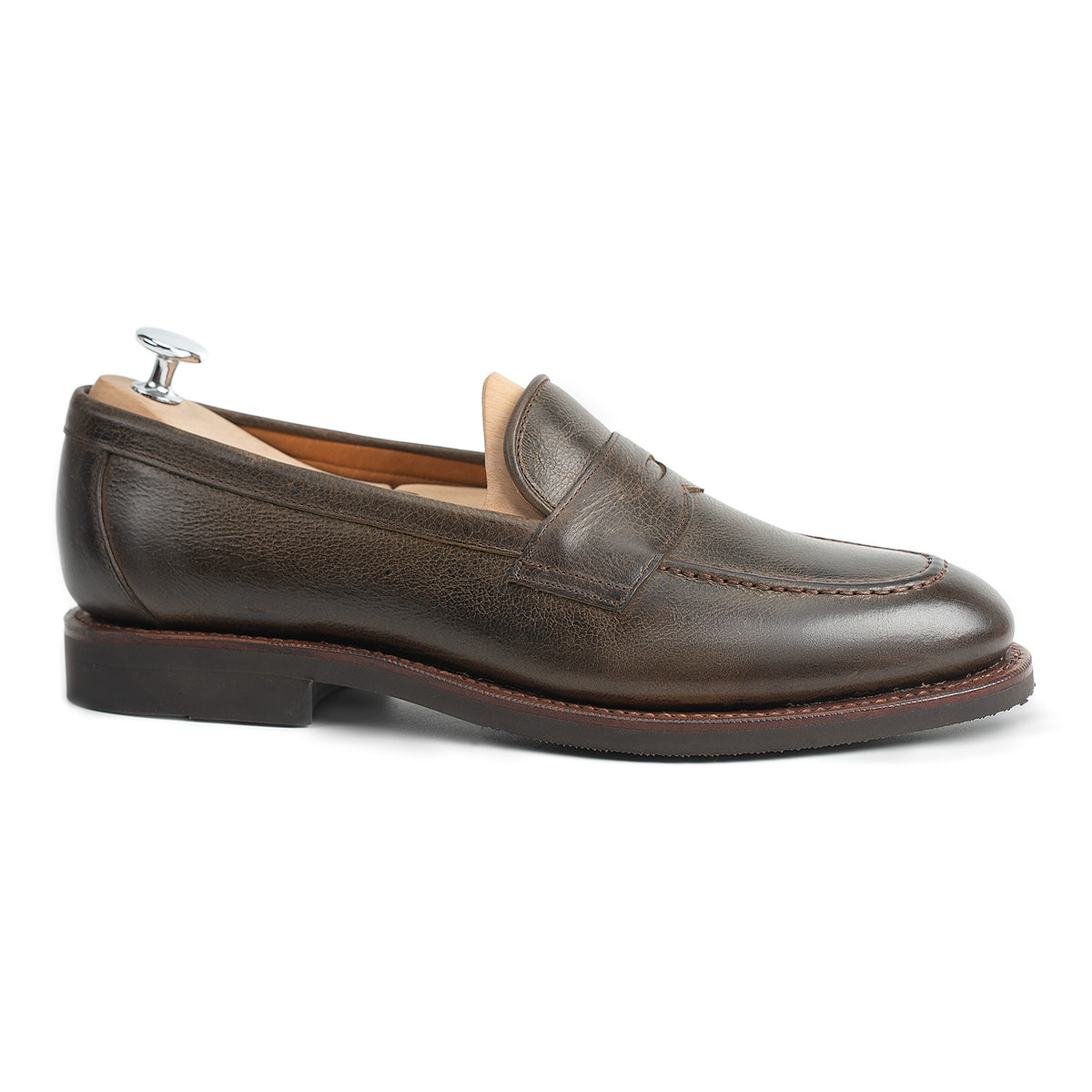 Meermin Caper Green naked kudu penny loafer, side profile on shoe tree, showing flex Goodyear welt and diamond latex rubber sole
