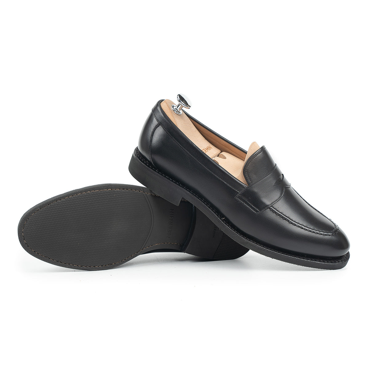 Meermin black silkcalf penny loafer pair, side profile with shoe tree inserted, sole shown propped against diamond rubber outsole