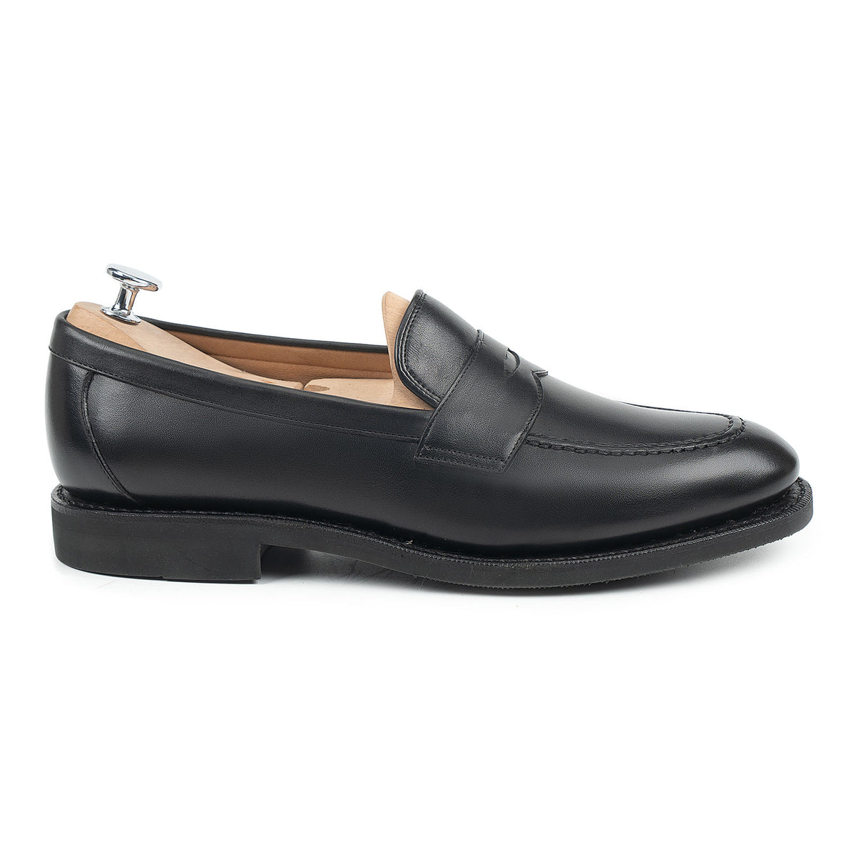 Meermin black silkcalf penny loafer, side profile with shoe tree inserted, showing handsewn apron and diamond latex sole