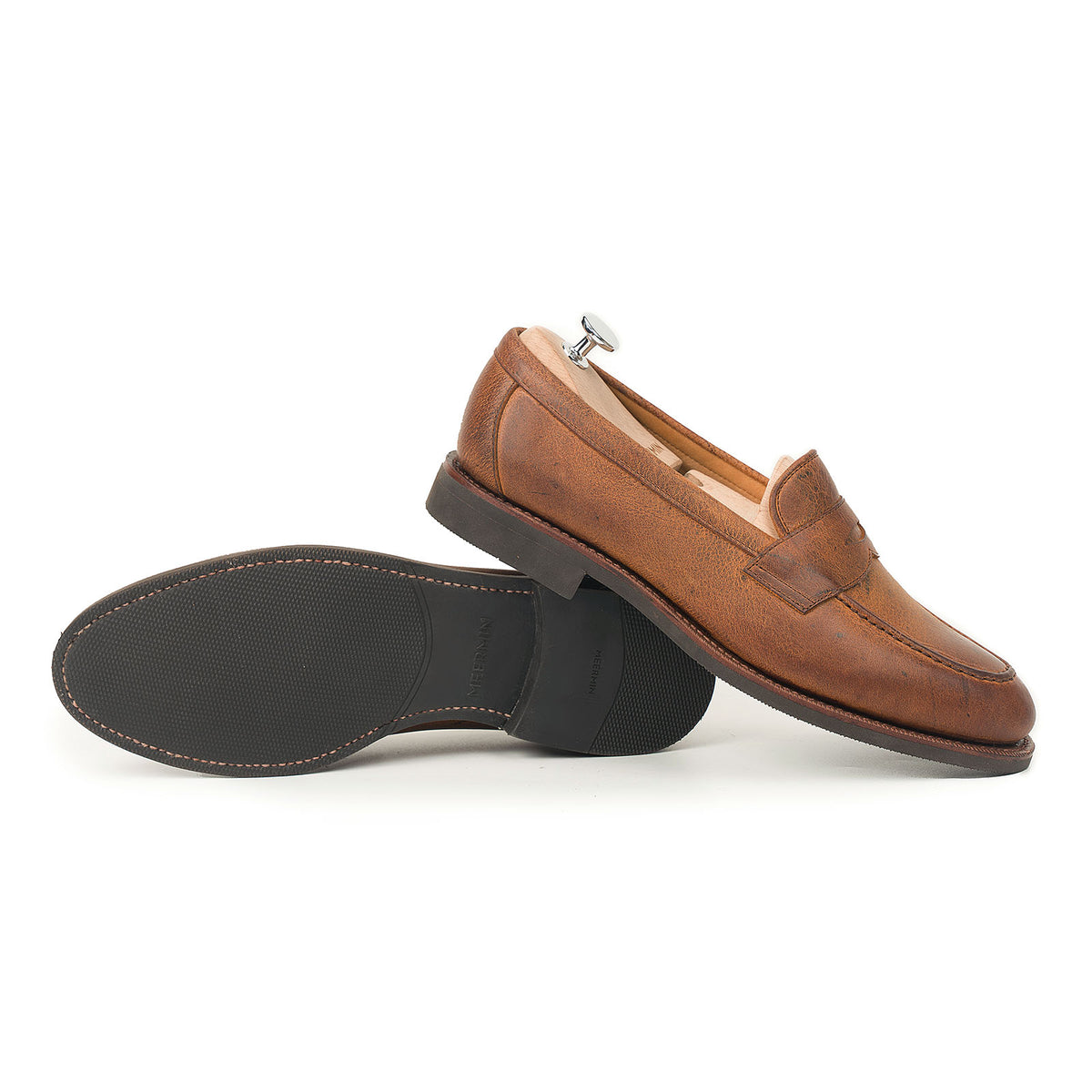 Meermin Autumn Spice waxy kudu penny loafers, side profile with one shoe upright showing sole tread, other resting on shoe tree