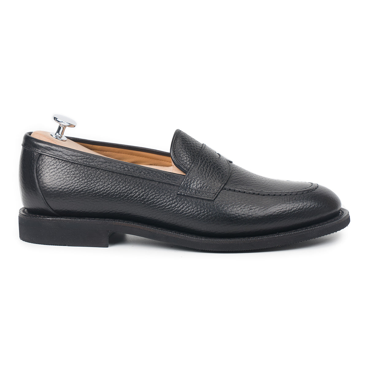 Meermin black Inca grain penny loafer, side profile showing handsewn apron and flex Goodyear welted diamond rubber sole