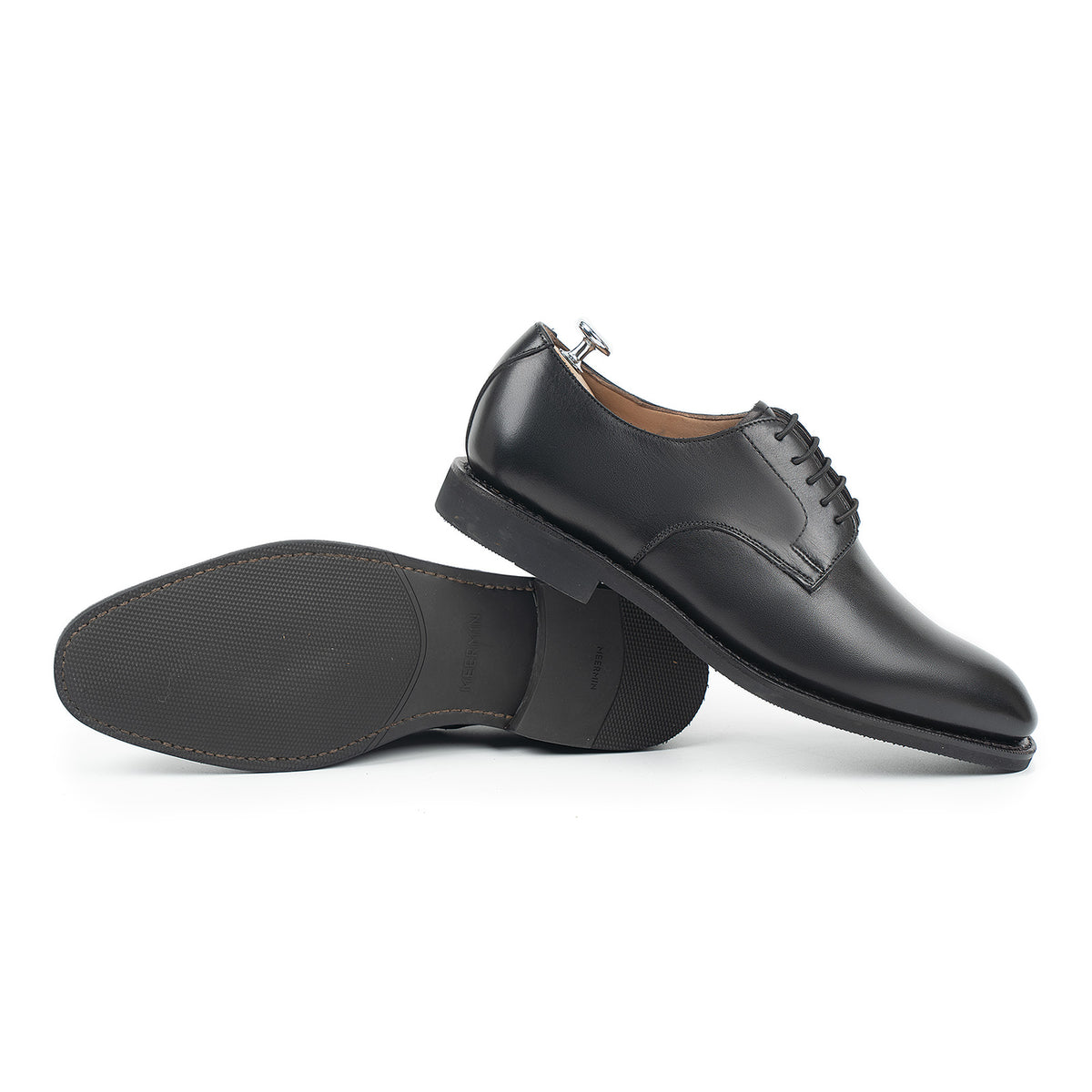 Meermin black silkcalf blucher pair, one shown sole-up displaying the diamond latex rubber sole and heel