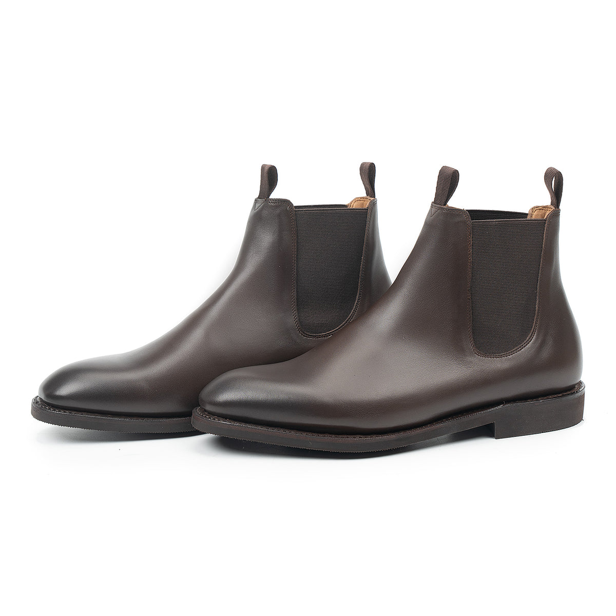 Meermin brown silkcalf Chelsea boots, three-quarter front view showing elastic side panels and diamond latex rubber soles