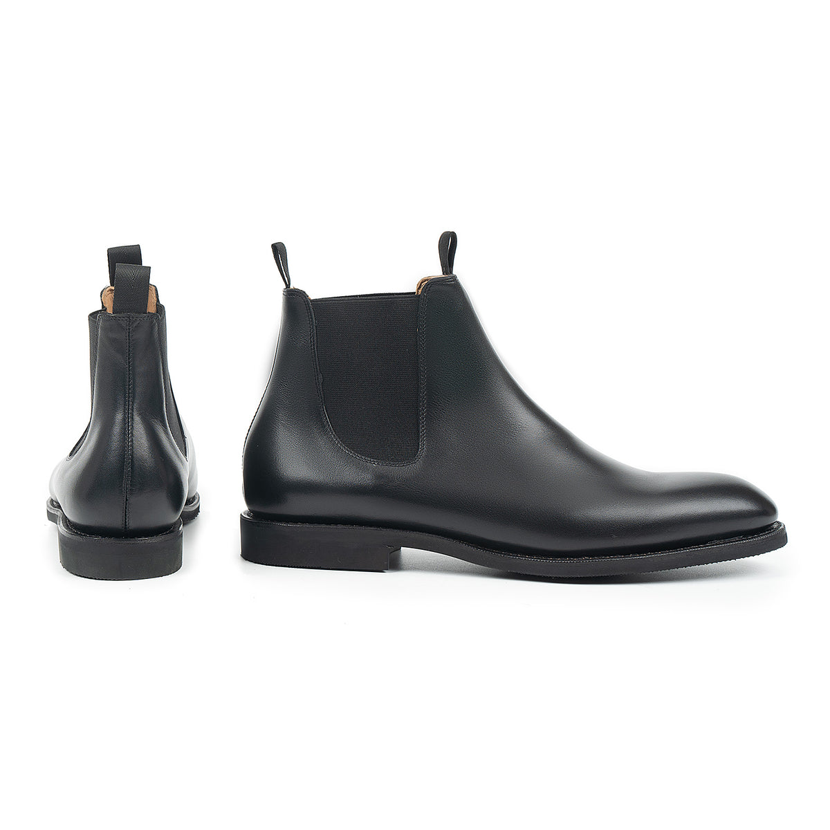 Meermin black silkcalf Chelsea boots shown in pairs, side profile and rear heel view highlighting elastic panels and pull tabs