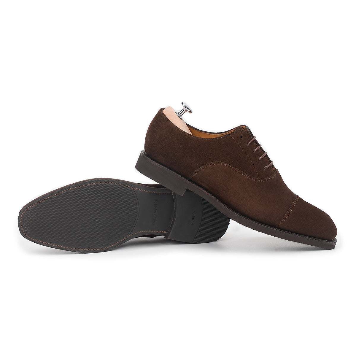 Meermin brown suede cap-toe Oxford, side profile with sole exposed on the resting pair, showing diamond latex rubber sole tread