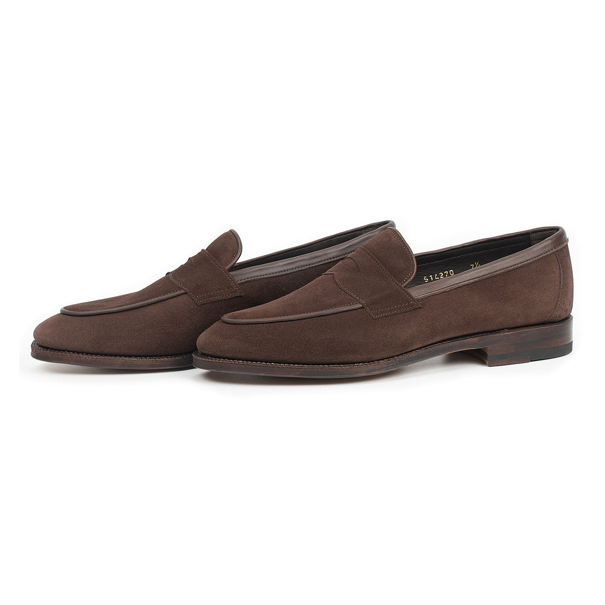 Meermin brown suede penny loafers, angled side-by-side view showing piping apron and stacked leather sole