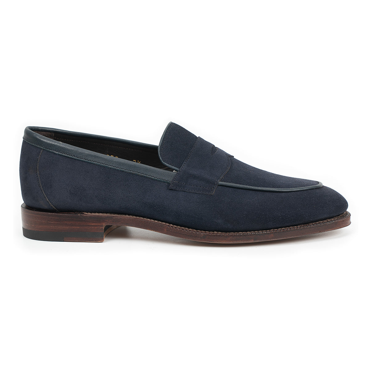 Meermin navy suede penny loafer, side profile showing piping apron trim and stacked leather sole