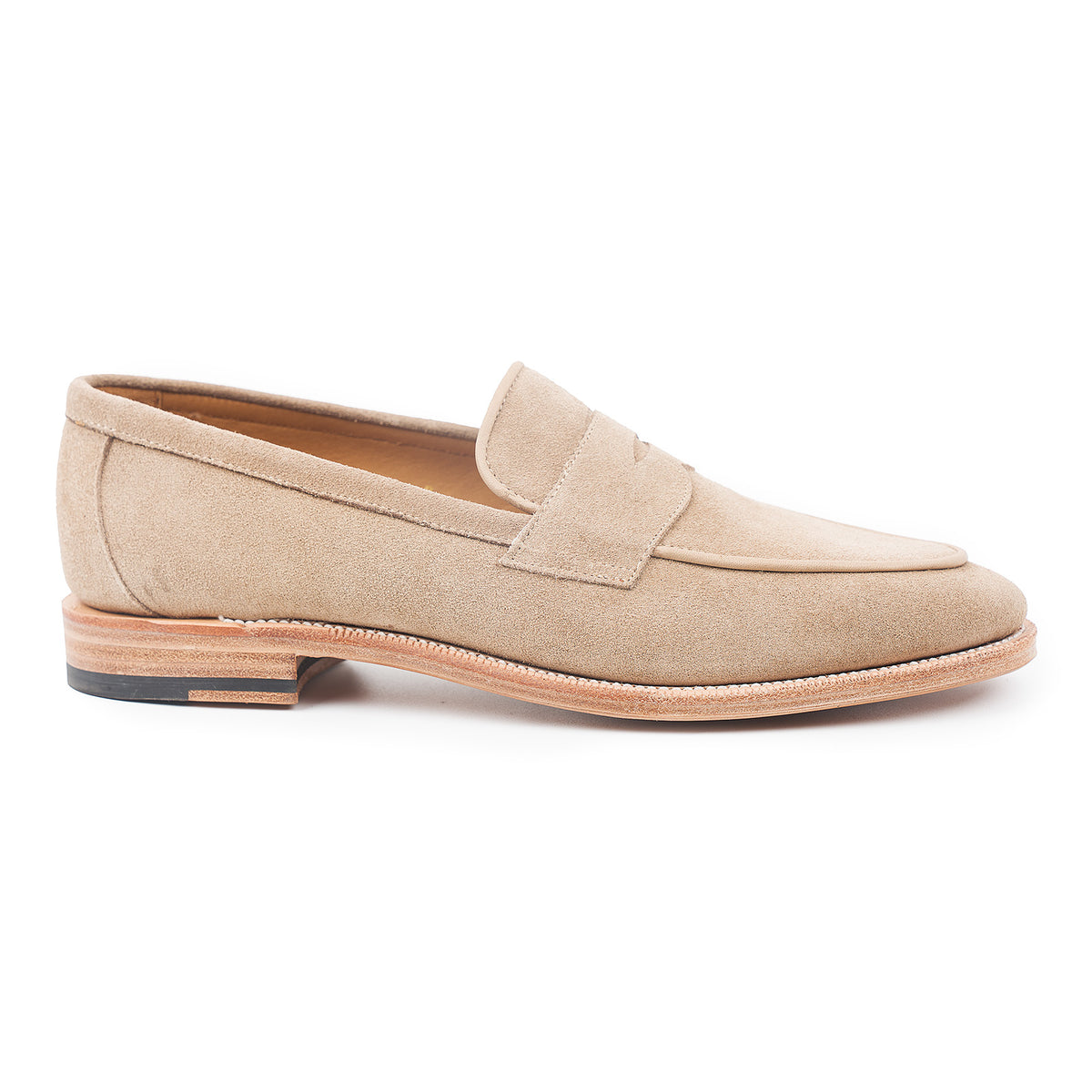 Meermin taupe suede penny loafer, side profile showing piping apron detail and flex Goodyear welted leather sole