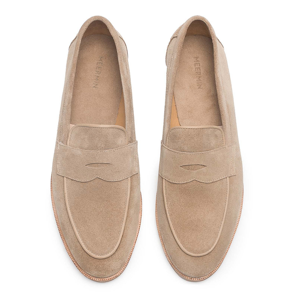 Meermin taupe suede penny loafers, top-down view of both shoes showing the piped apron and pinked leather sole edge