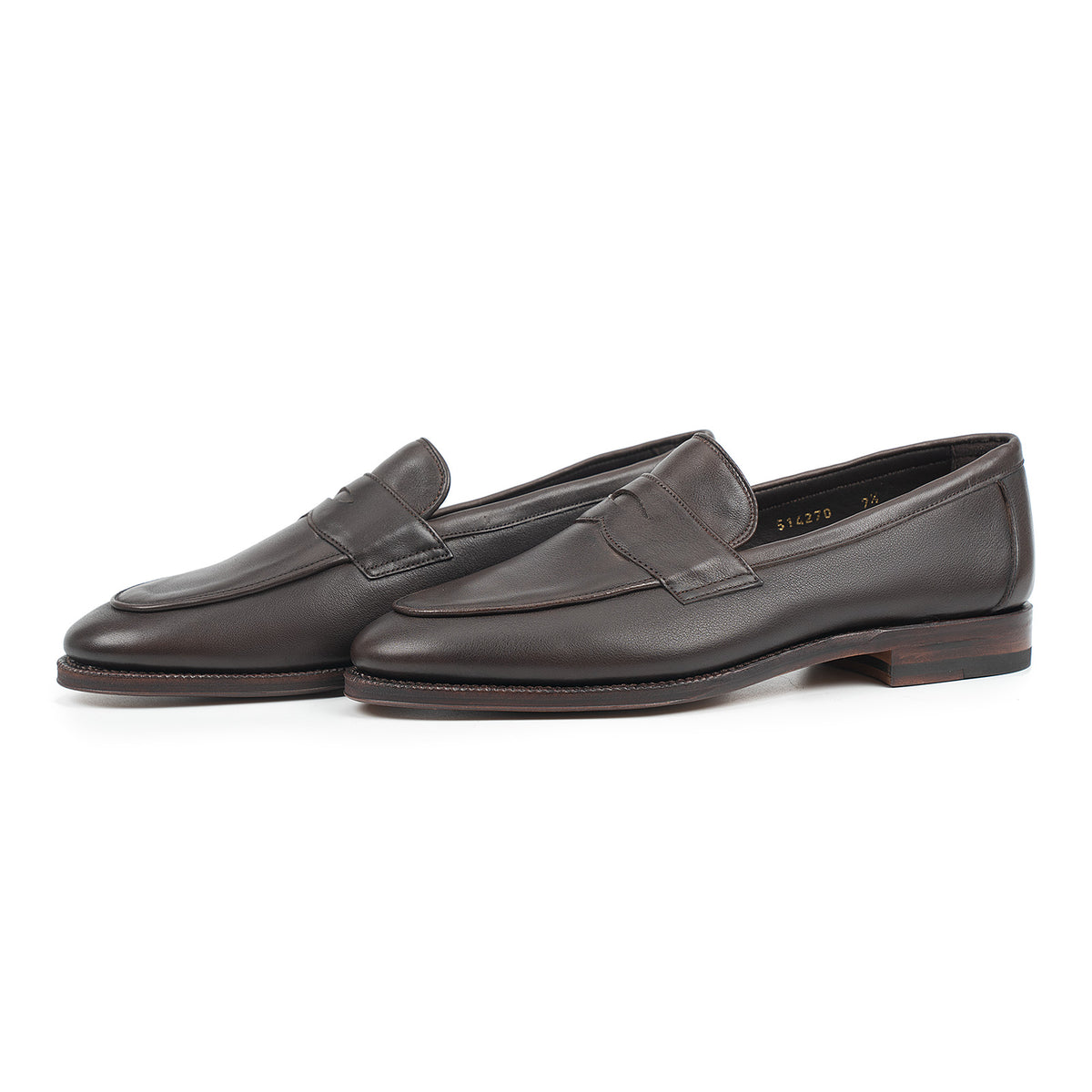 Meermin brown softcalf penny loafers, three-quarter side view of both shoes showing apron piping and leather sole