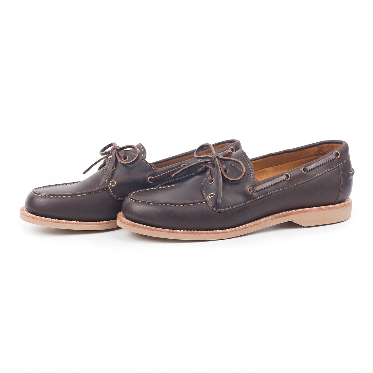 Meermin brown waxy calf boat shoes, three-quarter side view showing tied leather laces and taupe latex sole