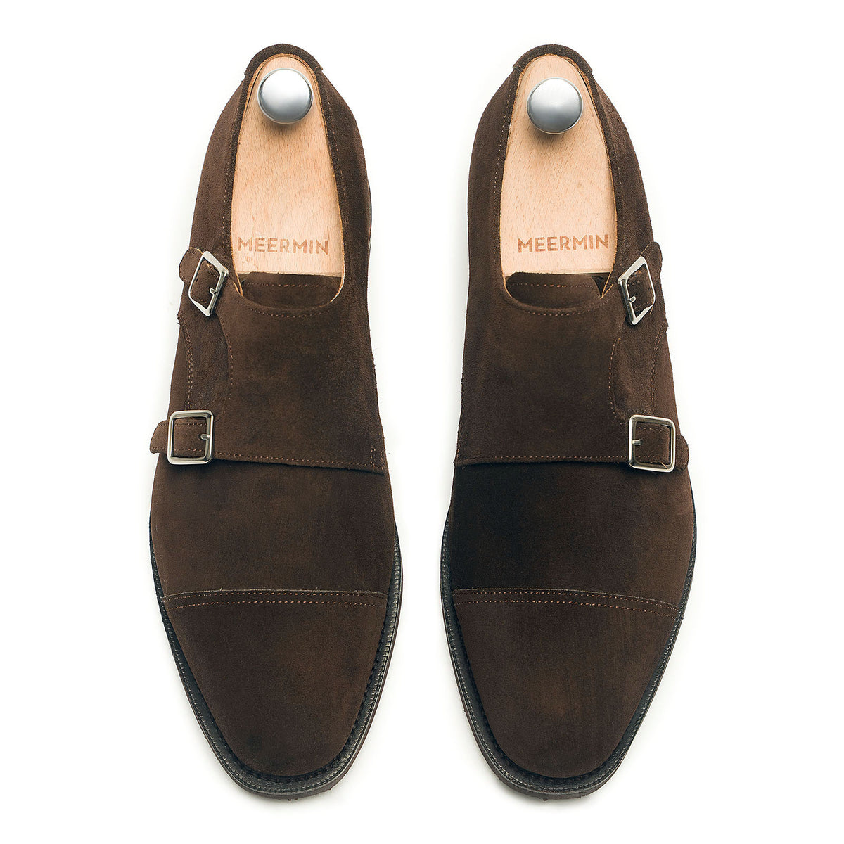 Meermin brown suede double monk strap shoes, top-down view on shoe trees, showing cap-toe and buckle detail