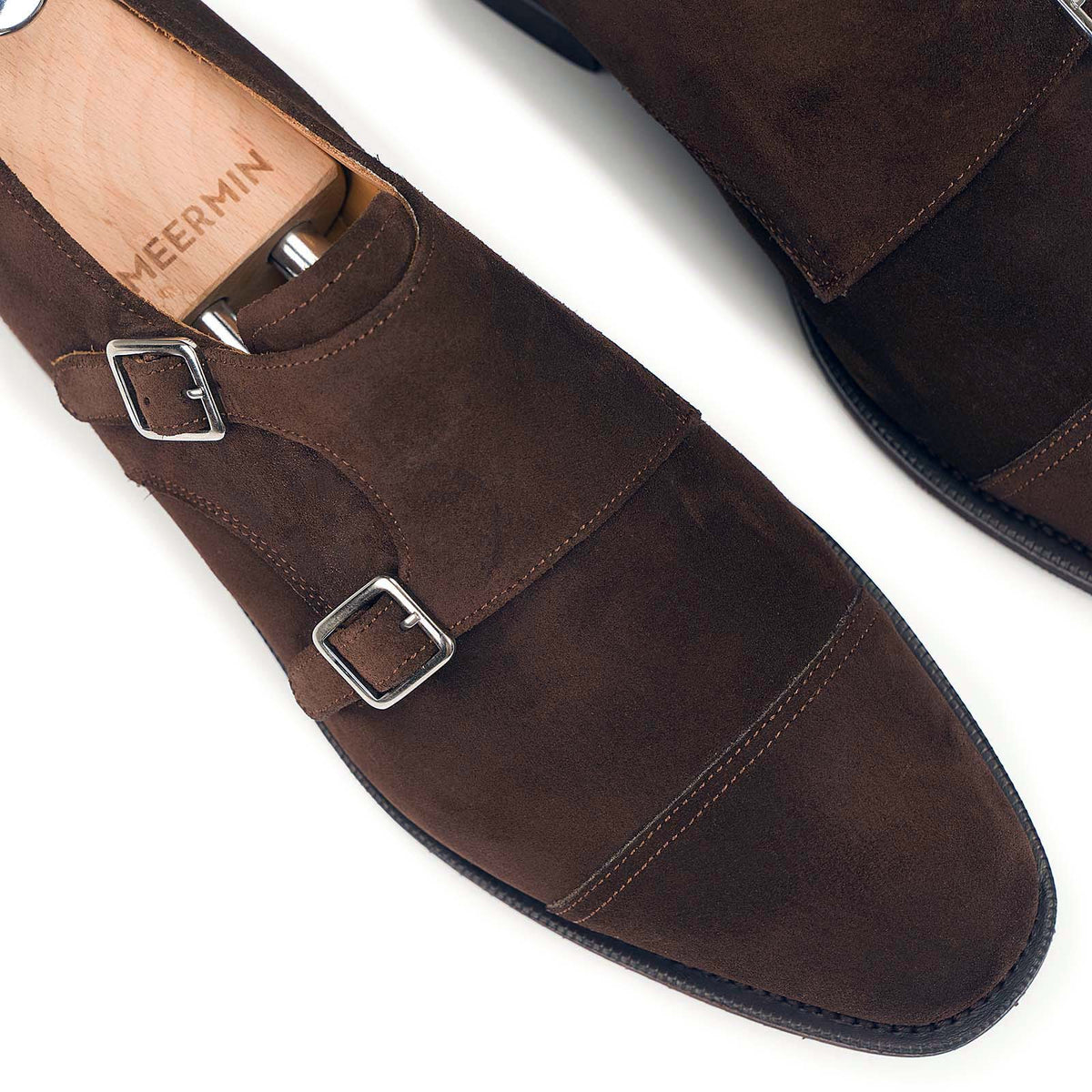 Close-up of Meermin brown suede double monk strap buckles and toe cap, shown on shoe tree with stitching detail visible