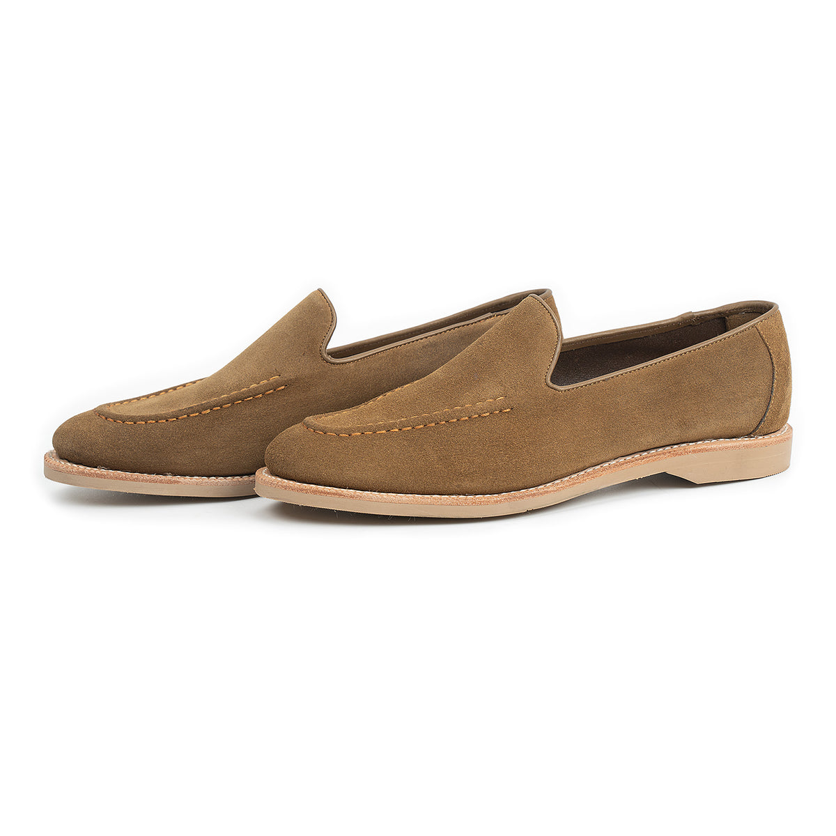 Meermin Atacama suede unlined loafers, three-quarter side view showing apron stitching and tonal Taupe rubber soles